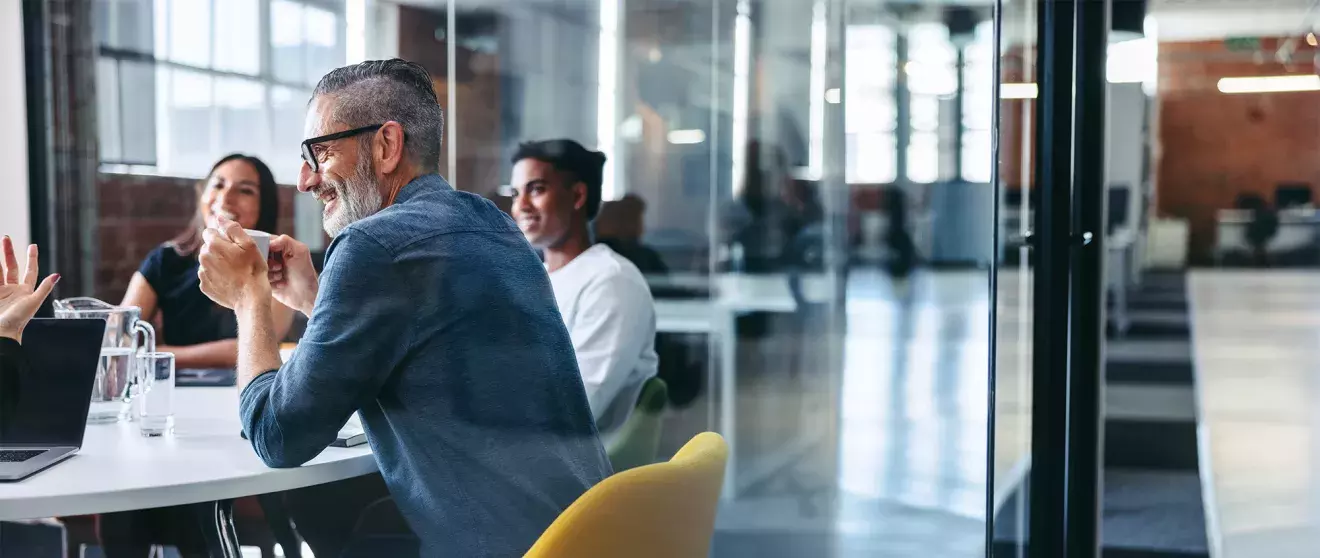 Group in office in a morning meeting
