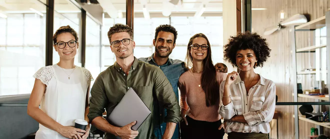 Group of young office workers smiling at camera