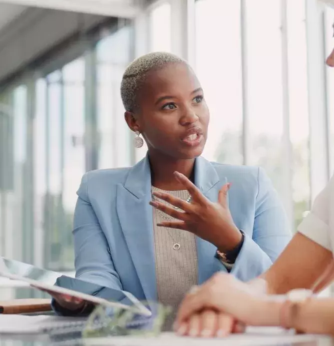 Representative discussing options with client on a tablet